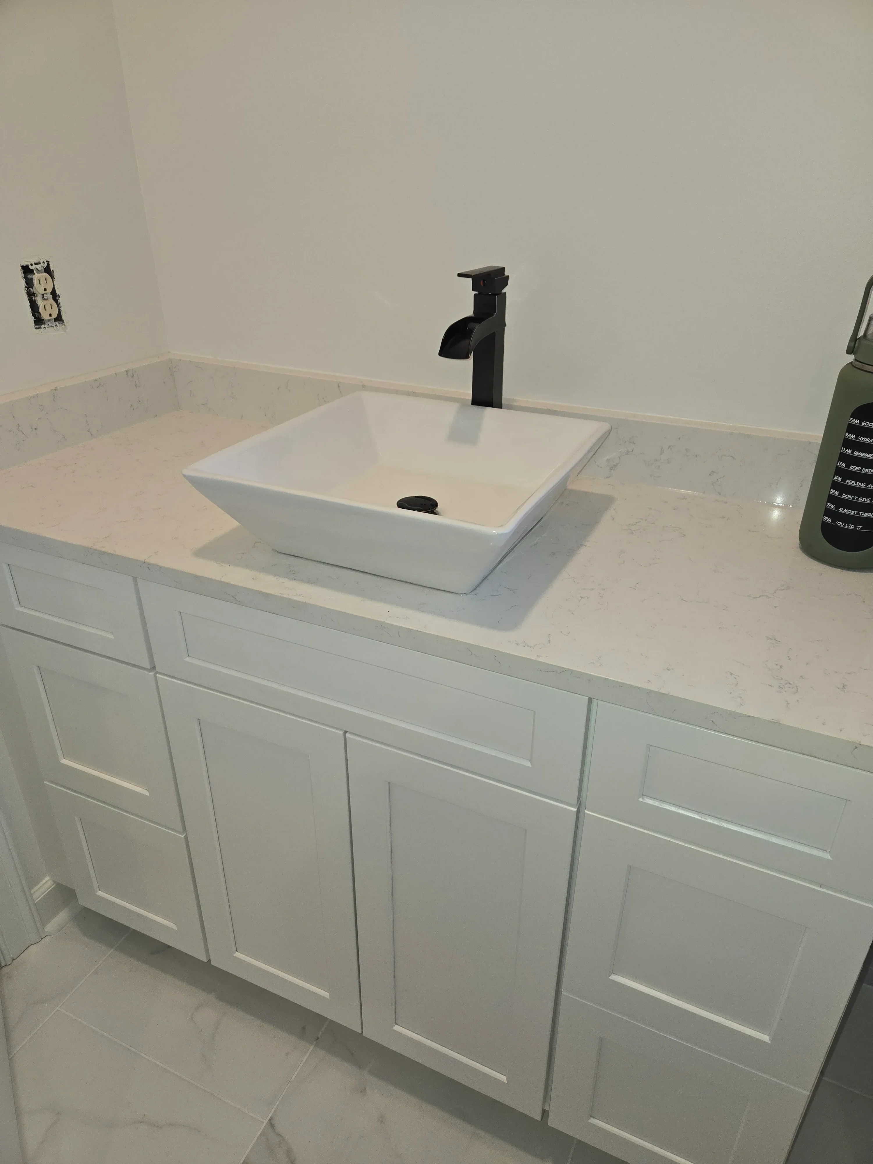 Ceiling exhaust fan with ductwork installed in drywall bathroom ceiling