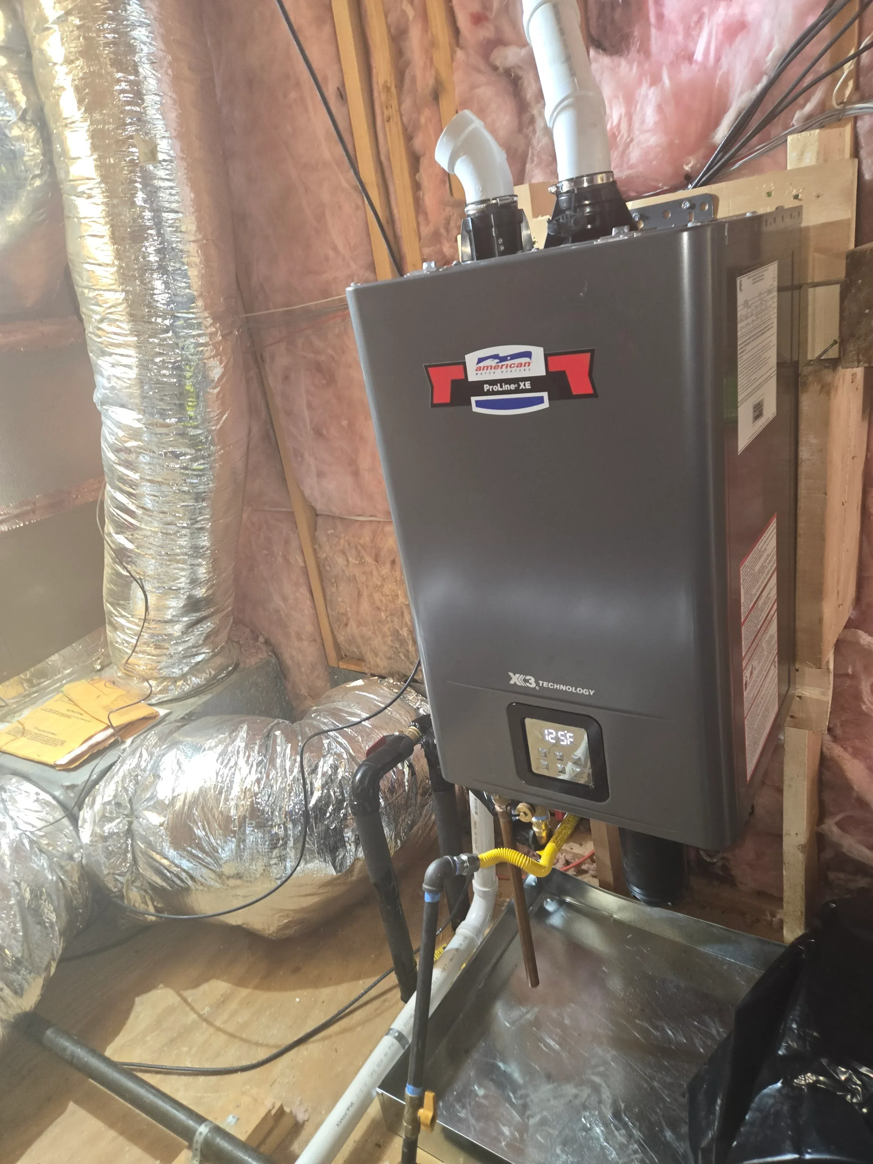 High-efficiency heat pump unit with digital controls, insulated flex ductwork, and electrical connections during installation