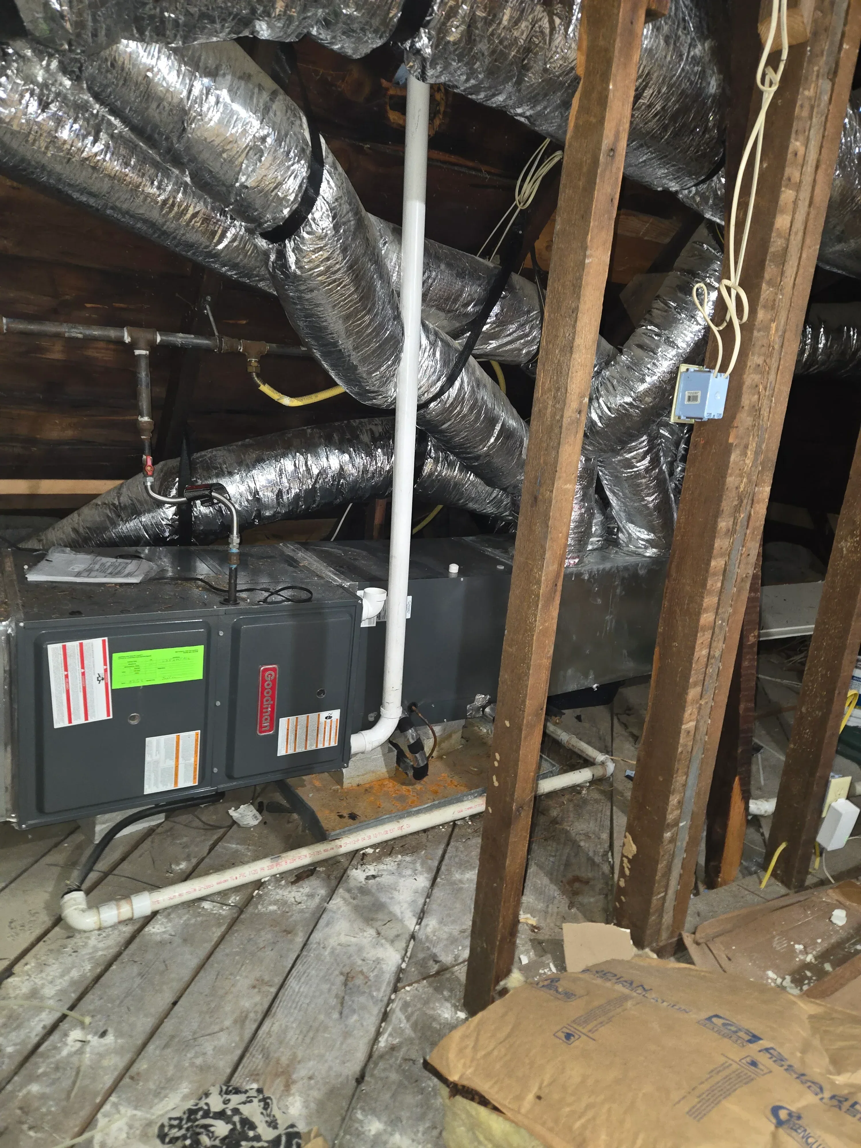 Goodman furnace with insulated flex ductwork and metal supply lines installed in basement framing